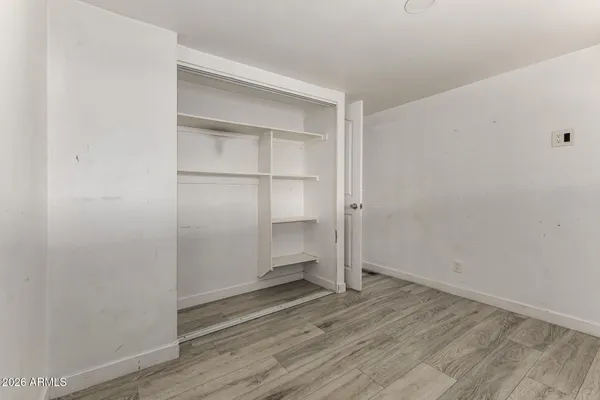 a view of an empty walk in closet