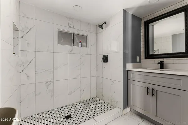 a bathroom with a sink and a mirror