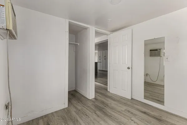 a view of entryway with wooden floor