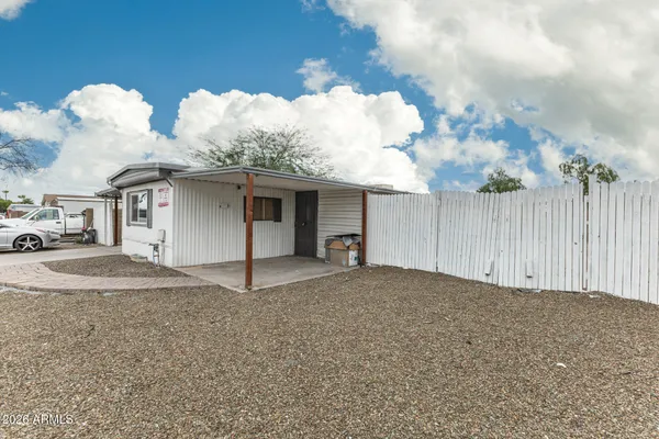 a view of a house with white walls