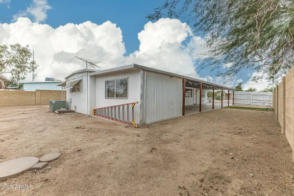 a view of a house with a yard and garage