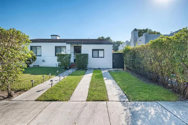 front view of a house with a yard