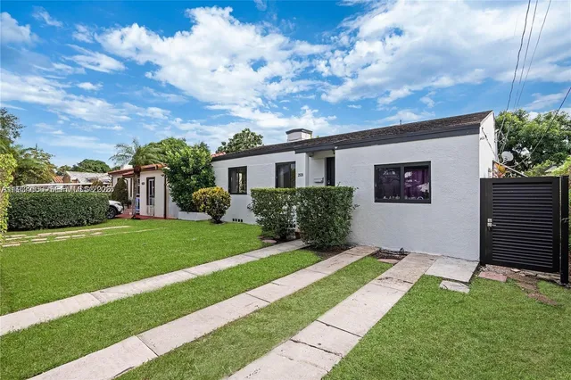 a house view with a garden space