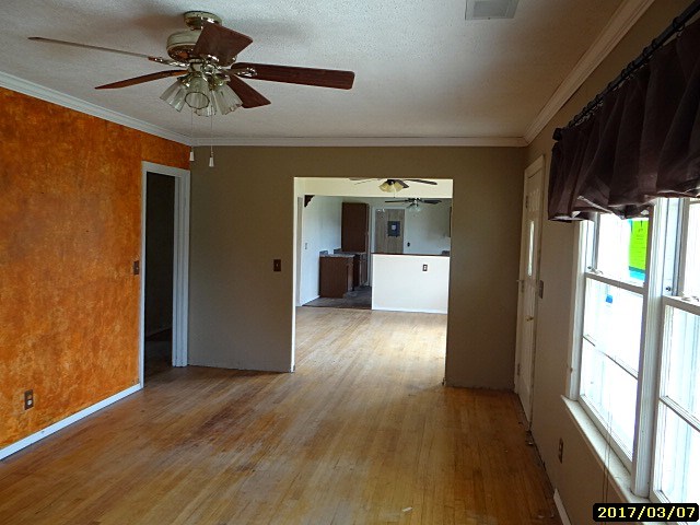 2 Moore Road Fort Mitchell, AL 36856 - Photo 11 of 16 a view of a kitchen with a refrigerator a ceiling fan and wooden floor