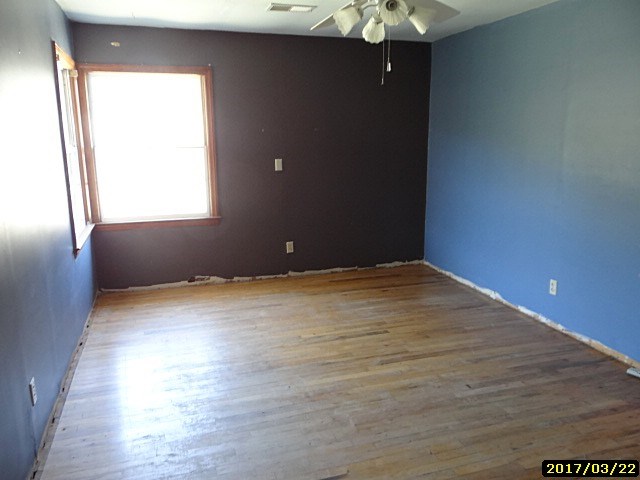 2 Moore Road Fort Mitchell, AL 36856 - Photo 7 of 16 a view of an empty room with wooden floor and a window