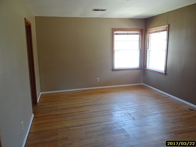 2 Moore Road Fort Mitchell, AL 36856 - Photo 8 of 16 an empty room with wooden floor and windows