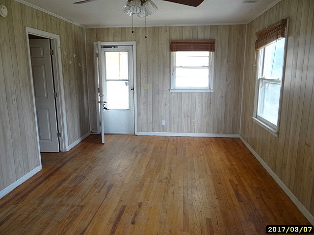 2 Moore Road Fort Mitchell, AL 36856 - Photo 9 of 16 an empty room with wooden floor and windows