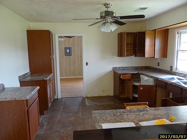 2 Moore Road Fort Mitchell, AL 36856 - Photo 10 of 16 a living room with stainless steel appliances kitchen island granite countertop furniture and a fireplace