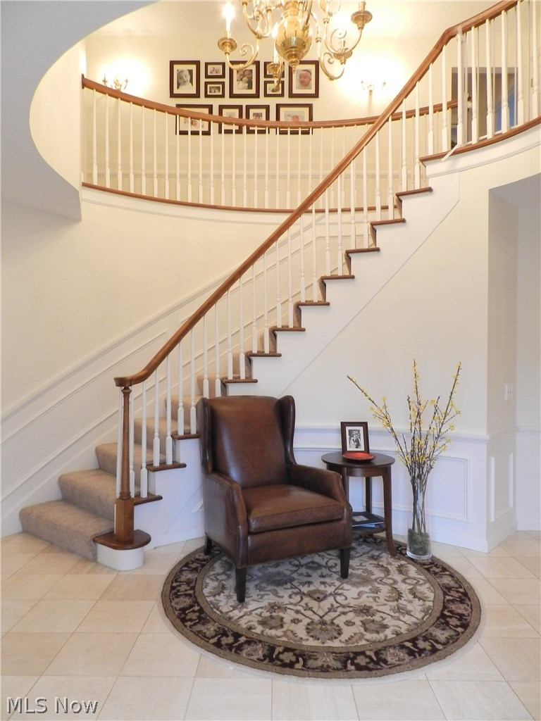 13419 County Line Road Chesterland, OH 44026 - Photo 1 of 21 The two-story marble foyer with curved staircase. There's a guest half bath and and deep coat closet off the foyer.