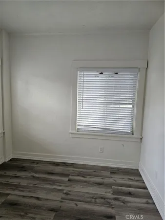 a view of a room that has a window and a window