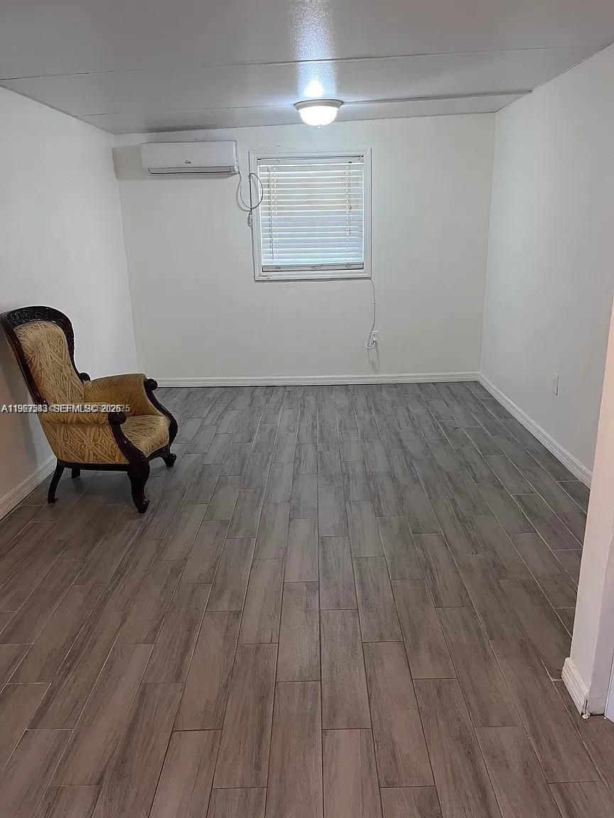 27 Southwest 55th Avenue Road Miami, FL 33134 - Photo 5 of 17 a view of wooden floor and chairs in a room