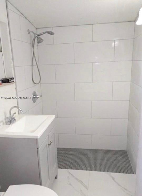 27 Southwest 55th Avenue Road Miami, FL 33134 - Photo 7 of 17 a bathroom with a sink a toilet and shower