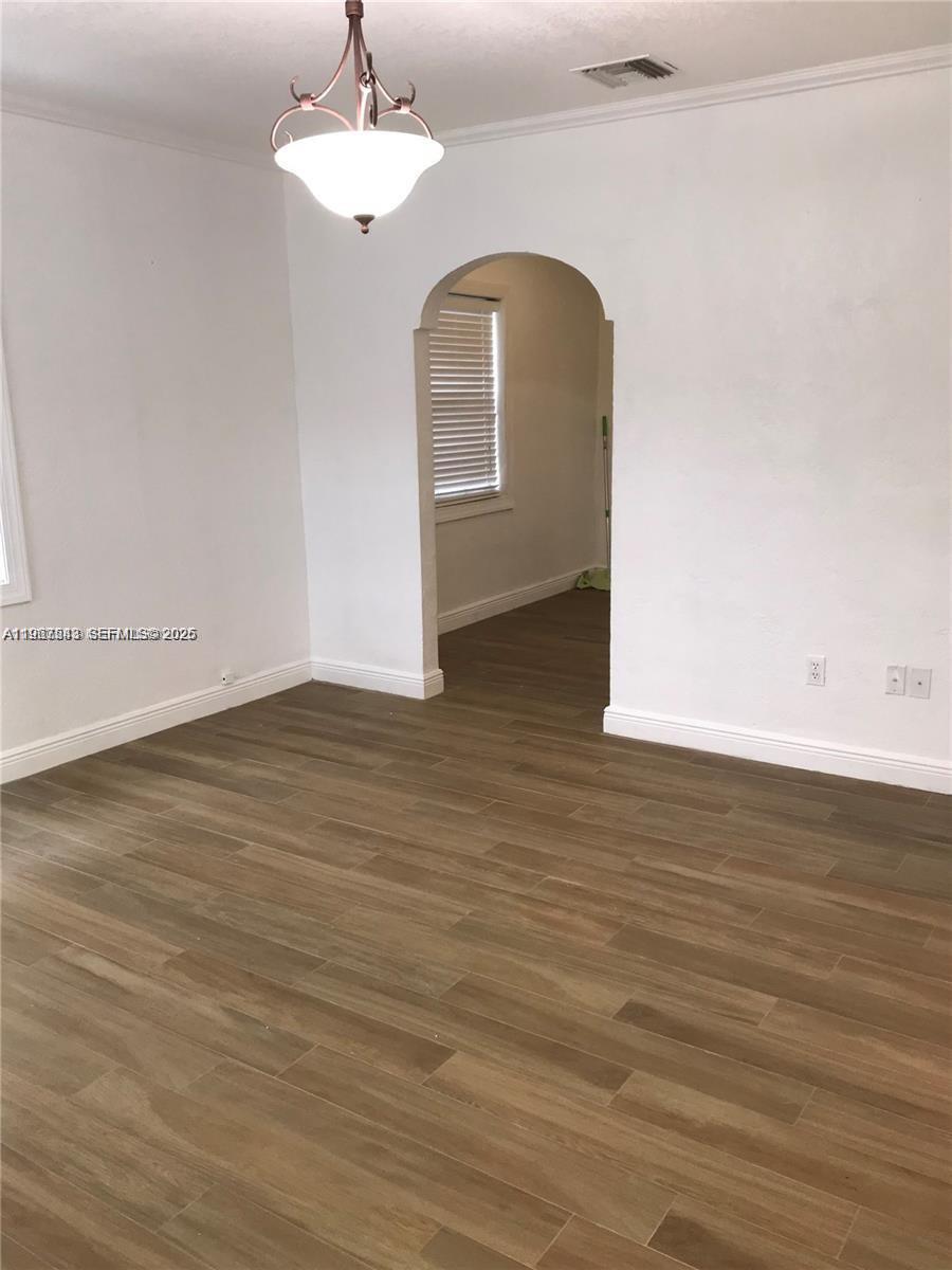27 Southwest 55th Avenue Road Miami, FL 33134 - Photo 9 of 17 a view of a room with wooden floor and window