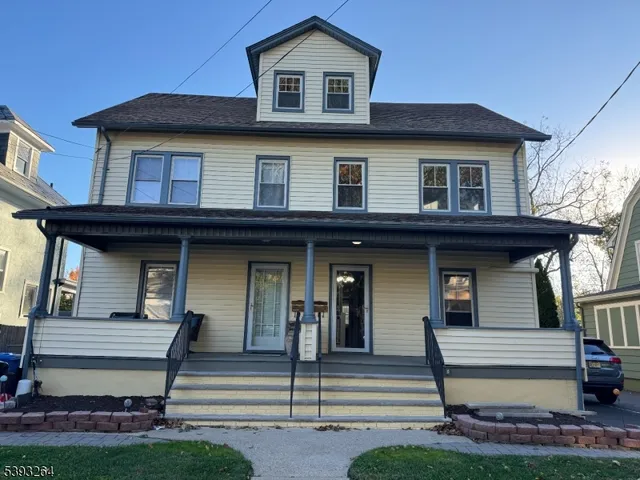 a view of a house with entrance gate and stairs