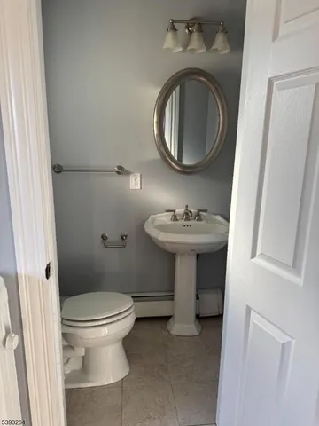 a bathroom with a toilet sink and vanity