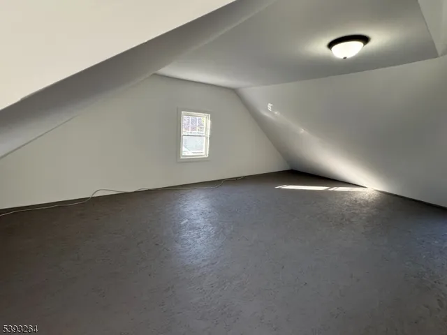 an empty room with a empty space and windows