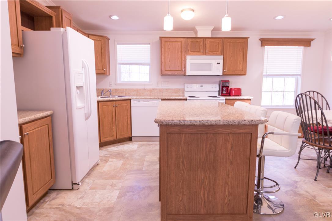 527 Norman Road Nazareth, PA 18064 - Photo 11 of 23 a kitchen with stainless steel appliances granite countertop a refrigerator and a stove top oven
