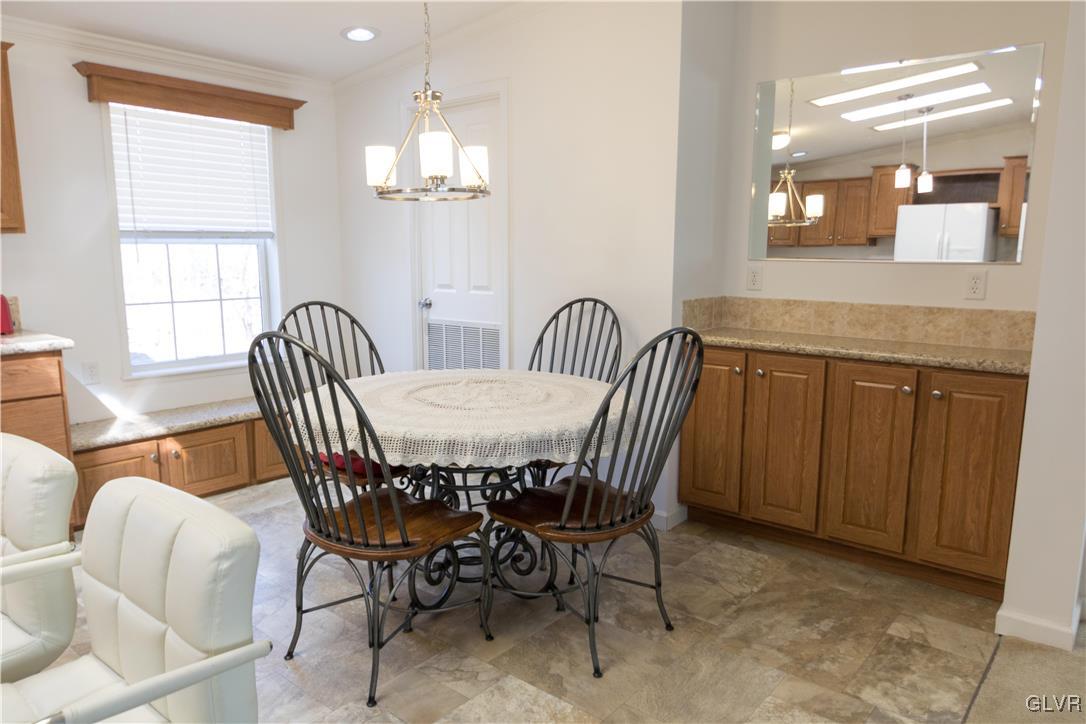 527 Norman Road Nazareth, PA 18064 - Photo 12 of 23 a view of a dining room with furniture and chandelier