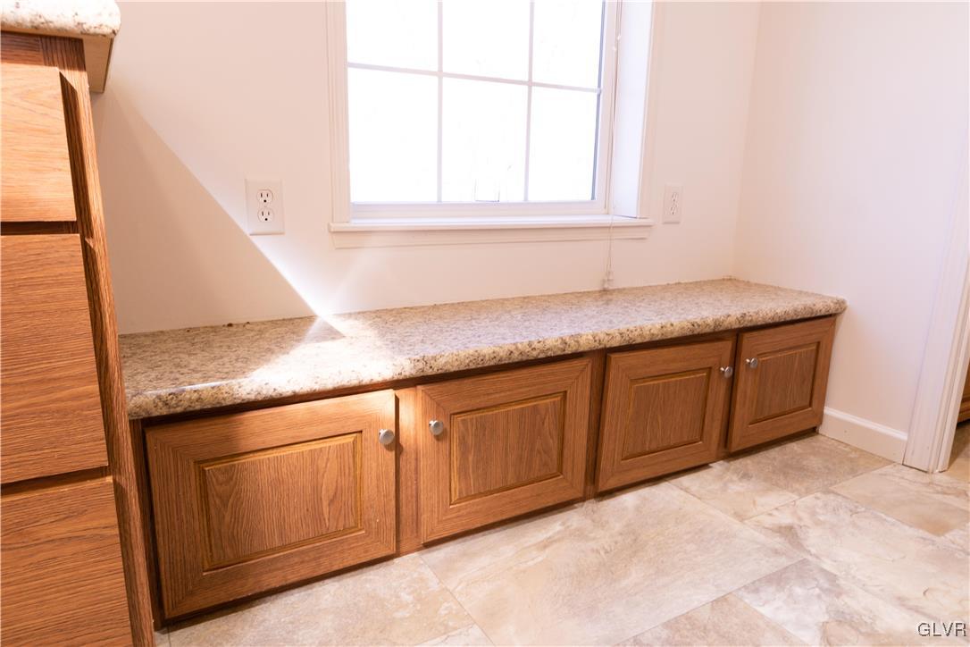 527 Norman Road Nazareth, PA 18064 - Photo 14 of 23 a kitchen with granite countertop cabinets and window