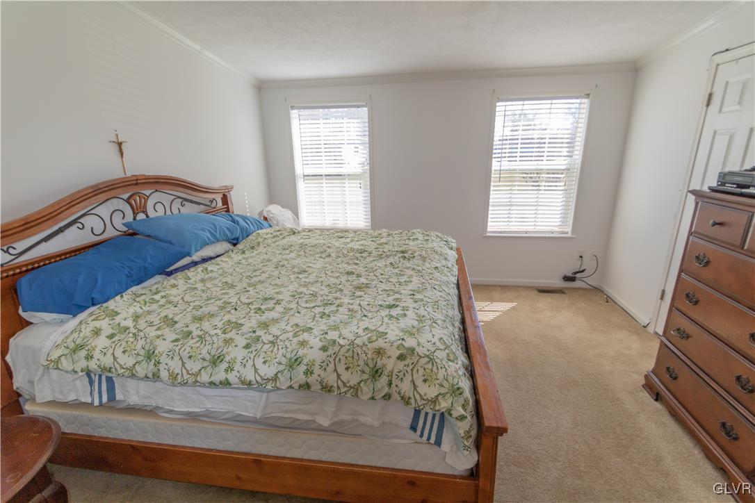 527 Norman Road Nazareth, PA 18064 - Photo 16 of 23 a bedroom with a bed and a window