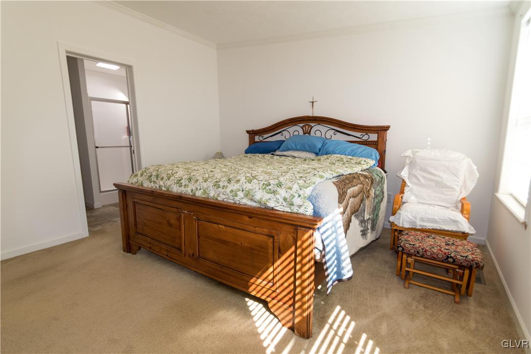 527 Norman Road Nazareth, PA 18064 - Photo 17 of 23 a bedroom with a bed and a mirror