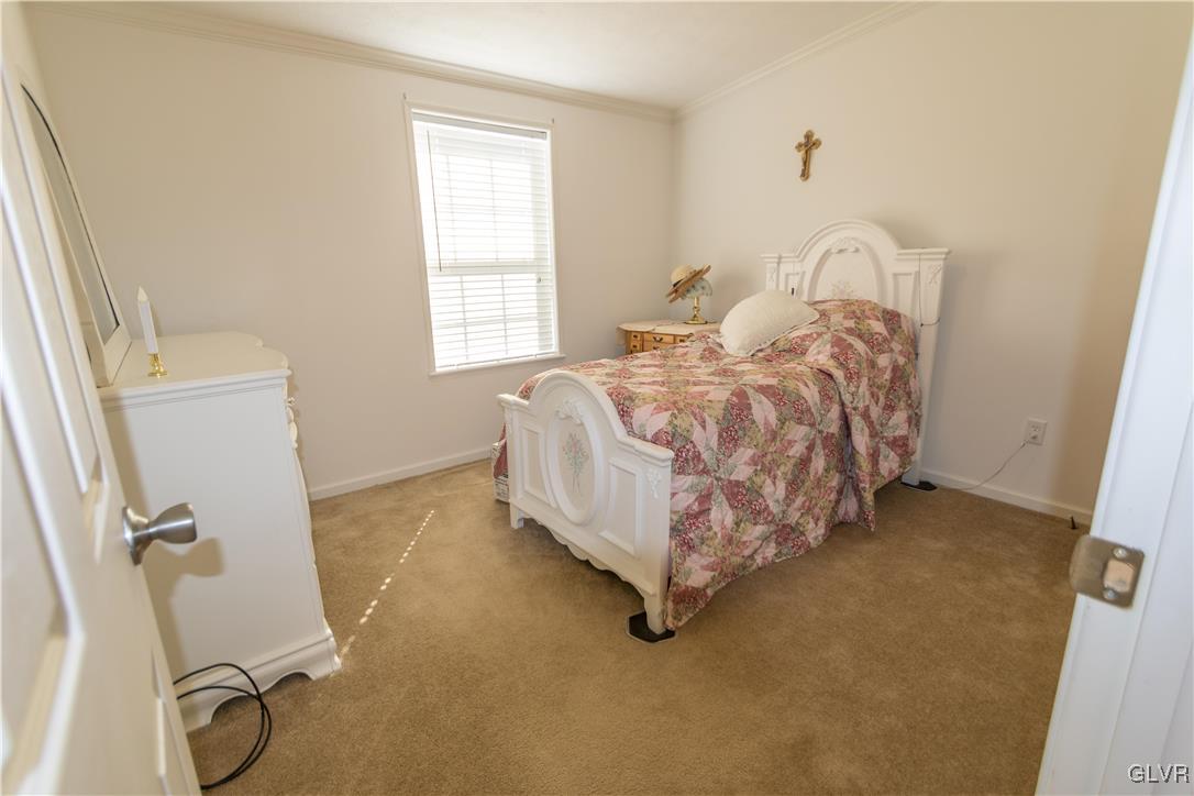 527 Norman Road Nazareth, PA 18064 - Photo 20 of 23 a bed sitting in a room next to a window