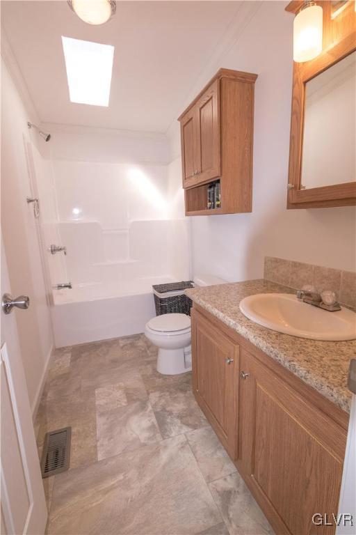 527 Norman Road Nazareth, PA 18064 - Photo 21 of 23 a bathroom with a granite countertop sink a toilet and a mirror
