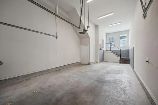 a view of a big room with closet and windows
