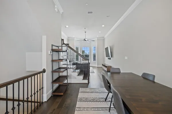 a view of a livingroom with furniture and staircase