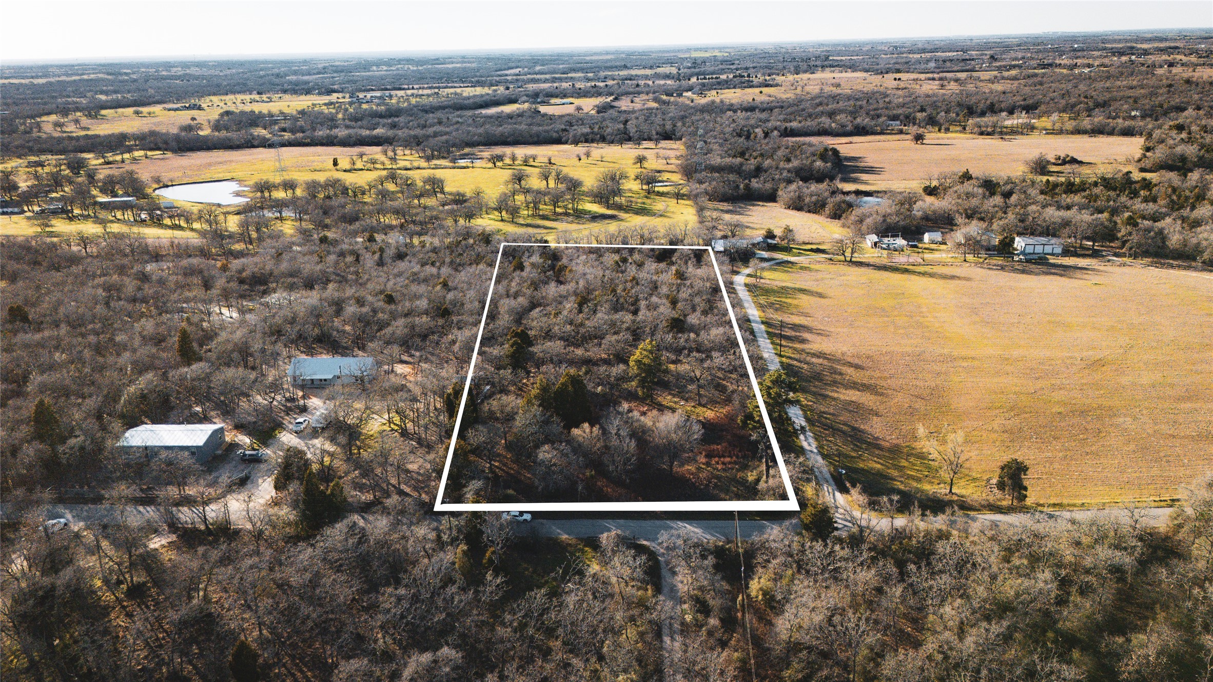 763 North County Line Road Elgin, TX 78621 - Photo 1 of 1 Birds eye view of property with a rural view