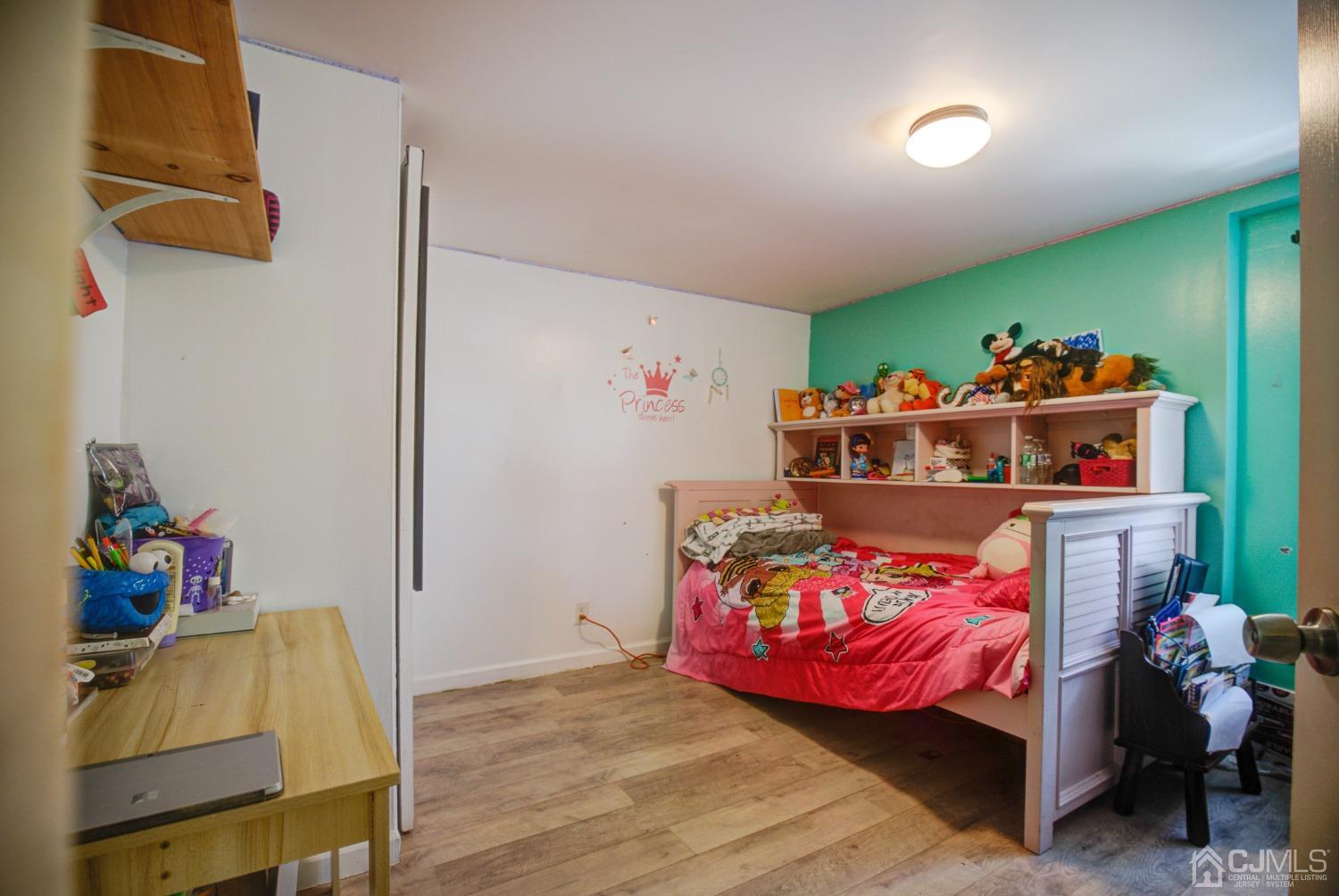 431 Baker Place Perth Amboy, NJ 08861 - Photo 15 of 16 a bedroom with furniture and a baby crib