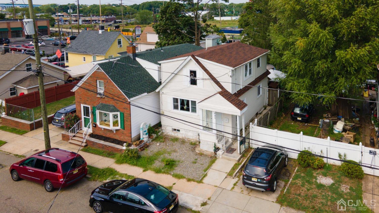 431 Baker Place Perth Amboy, NJ 08861 - Photo 2 of 16 an aerial view of a house with swimming pool and ocean view