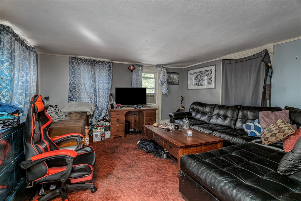 260 State Road Phillipston, MA 01331 - Photo 16 of 42 a living room with furniture a flat screen tv and paintings on the wall