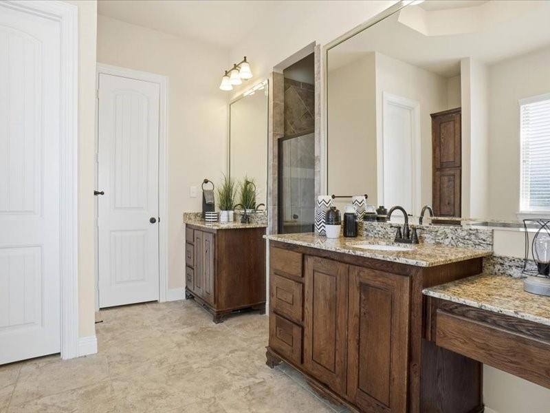 4021 West J E Woody Road Springtown, TX 76082 - Photo 23 of 37 Master bathroom with two separate vanities and make up area