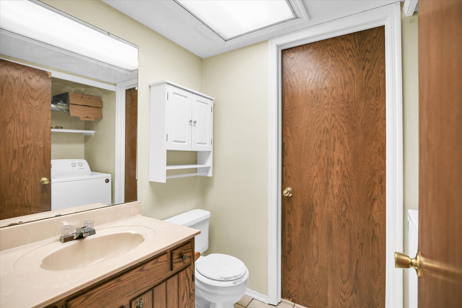 1905 Christopher Circle, Unit 4 Urbana, IL 61802 - Photo 22 of 29 a bathroom with a sink a toilet a shower and a mirror