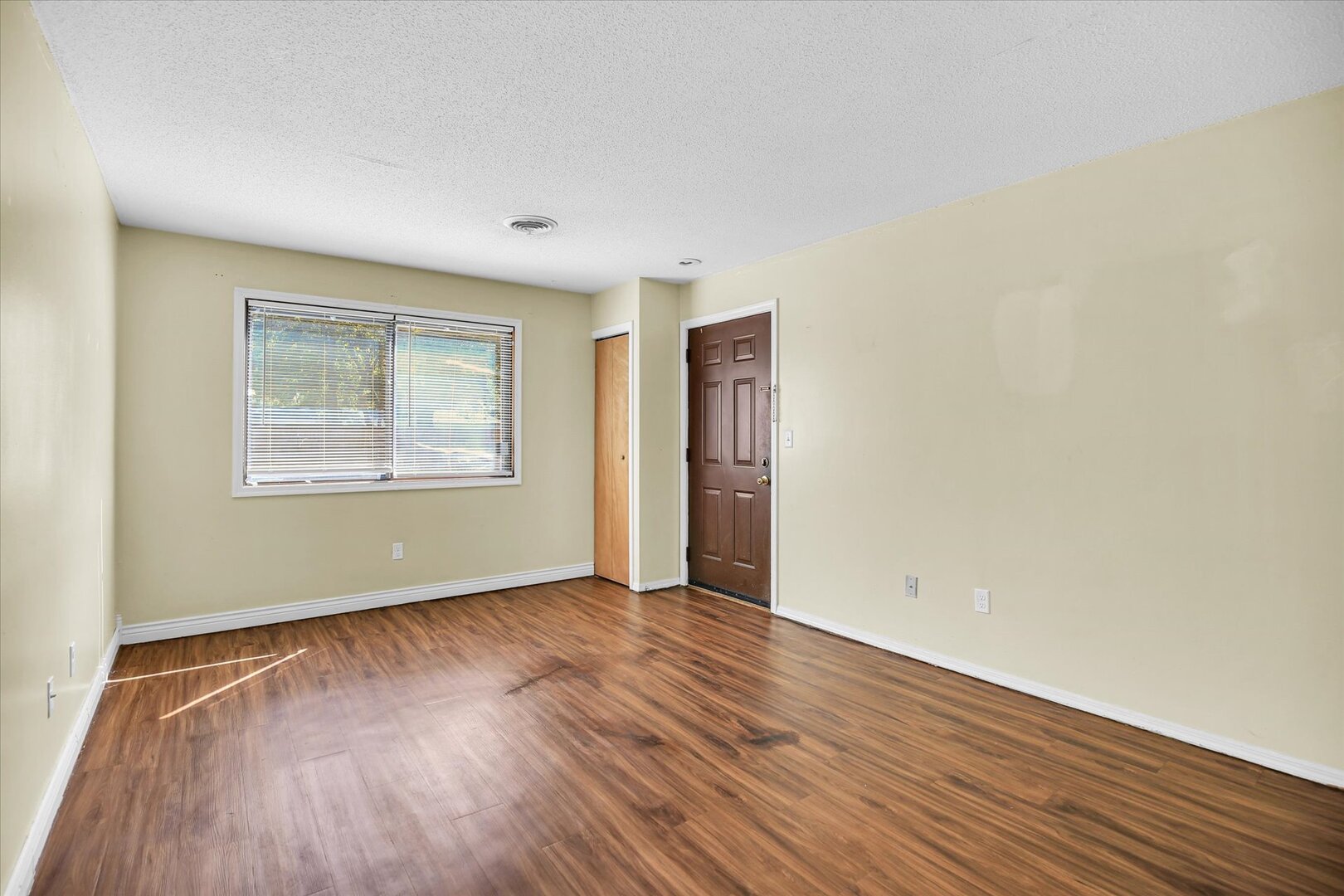1905 Christopher Circle, Unit 4 Urbana, IL 61802 - Photo 7 of 29 an empty room with wooden floor and windows