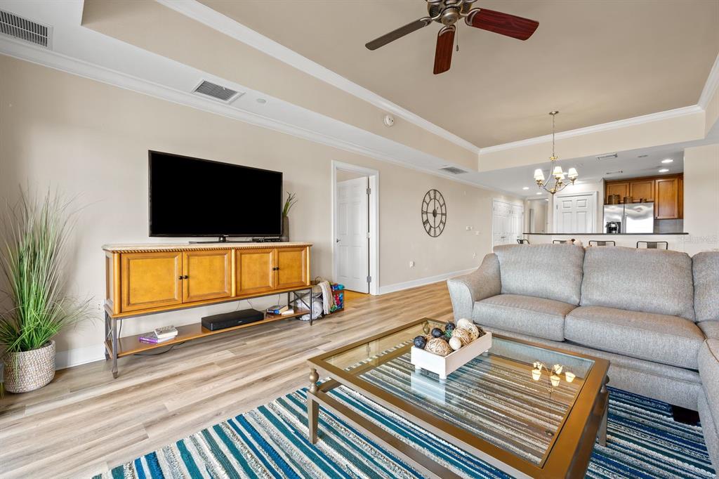 1370 Centre Ct Ridge Drive, Unit 401 Reunion, FL 34747 - Photo 16 of 51 a living room with furniture and a flat screen tv
