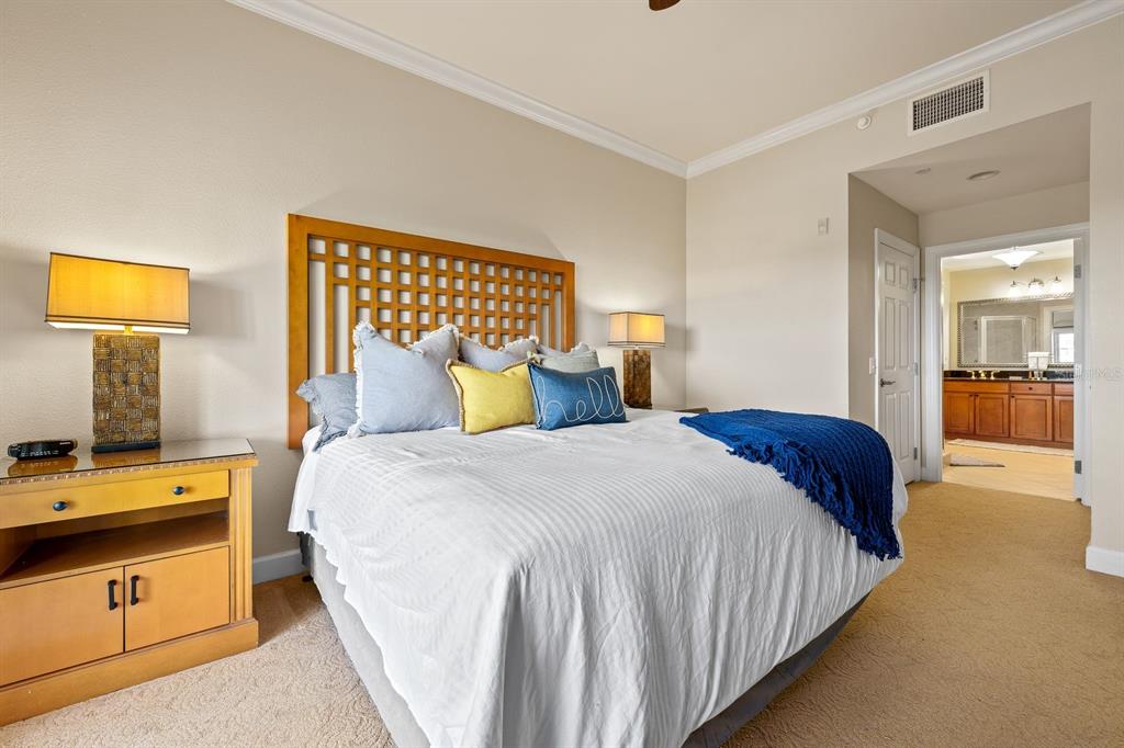 1370 Centre Ct Ridge Drive, Unit 401 Reunion, FL 34747 - Photo 17 of 51 a bedroom with a bed and wooden floor