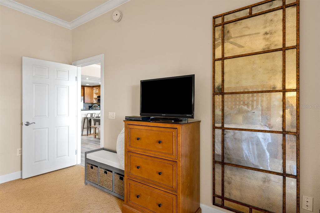1370 Centre Ct Ridge Drive, Unit 401 Reunion, FL 34747 - Photo 19 of 51 a room with furniture and flat screen tv