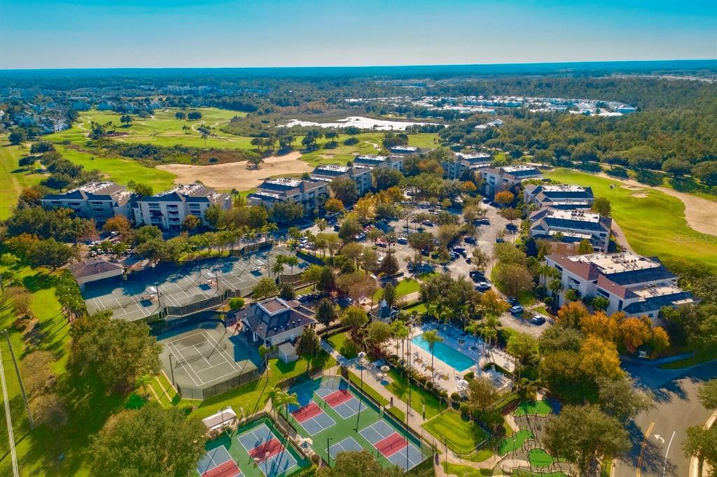 1370 Centre Ct Ridge Drive, Unit 401 Reunion, FL 34747 - Photo 2 of 51 an aerial view of residential building and lake
