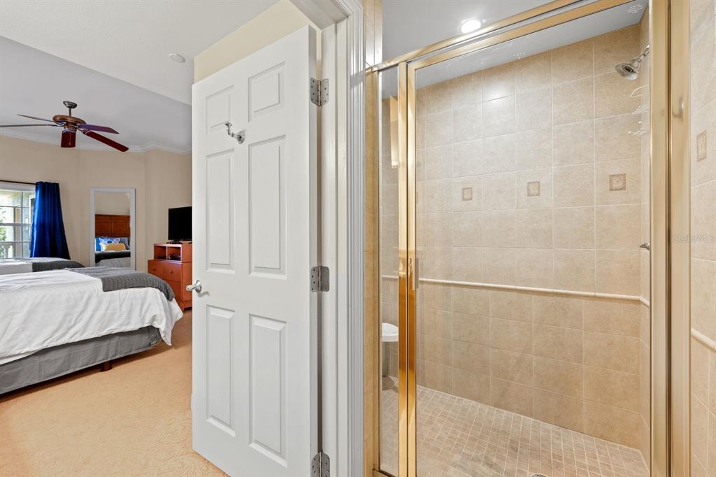 1370 Centre Ct Ridge Drive, Unit 401 Reunion, FL 34747 - Photo 25 of 51 a en suite bathroom with a shower and a bath tub