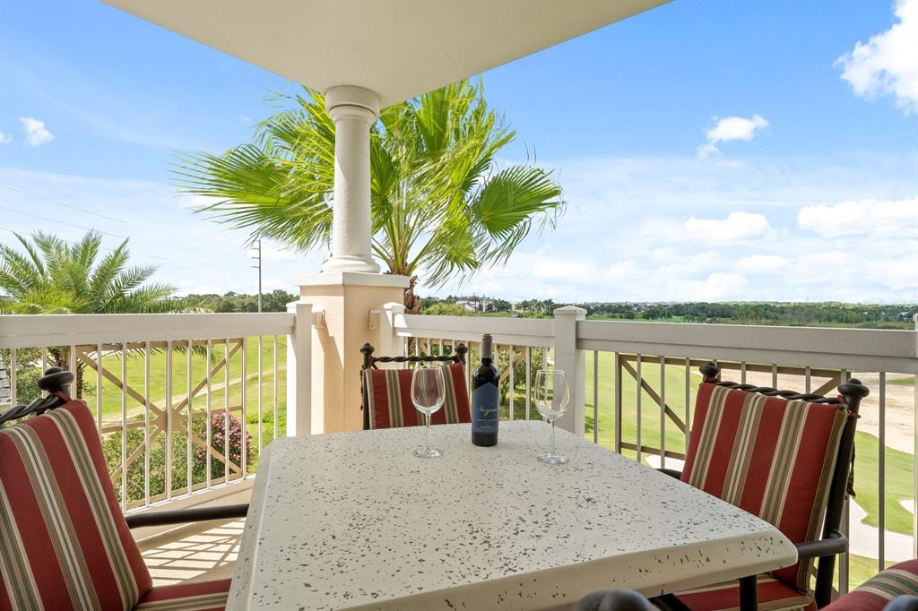 1370 Centre Ct Ridge Drive, Unit 401 Reunion, FL 34747 - Photo 32 of 51 a view of swimming pool with a table and chairs