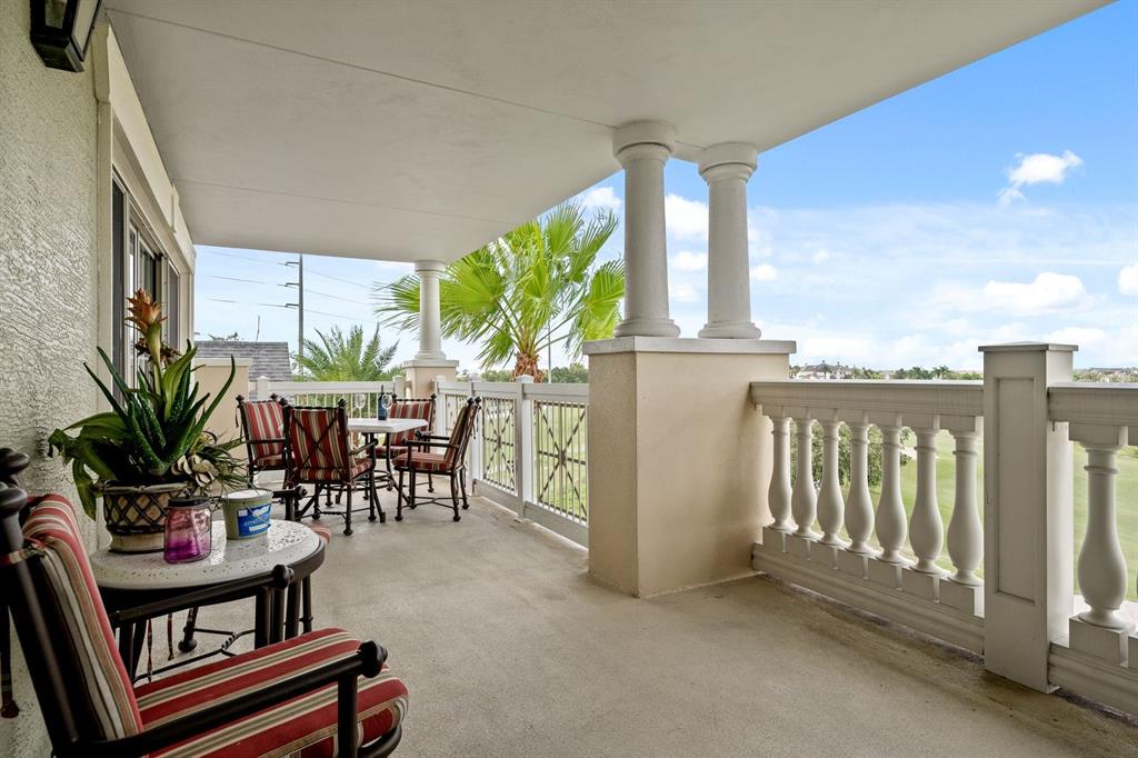 1370 Centre Ct Ridge Drive, Unit 401 Reunion, FL 34747 - Photo 34 of 51 a view of a chairs and table in patio