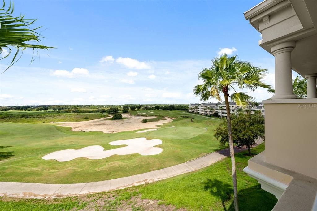 1370 Centre Ct Ridge Drive, Unit 401 Reunion, FL 34747 - Photo 36 of 51 a view of a lake with a big yard