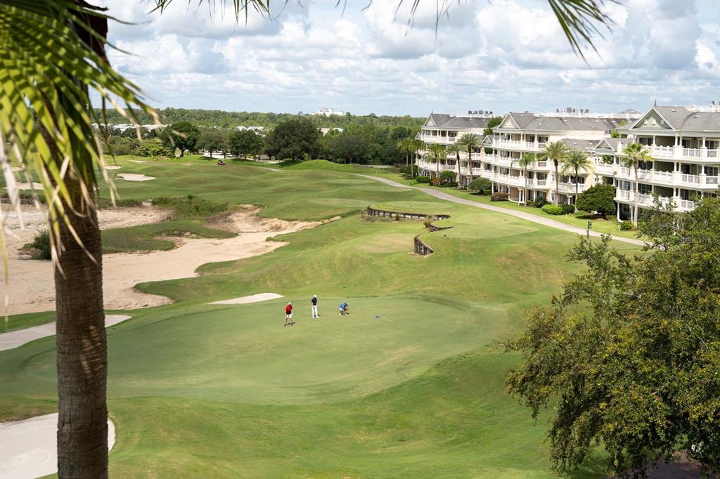 1370 Centre Ct Ridge Drive, Unit 401 Reunion, FL 34747 - Photo 37 of 51 a view of a lake with a large trees