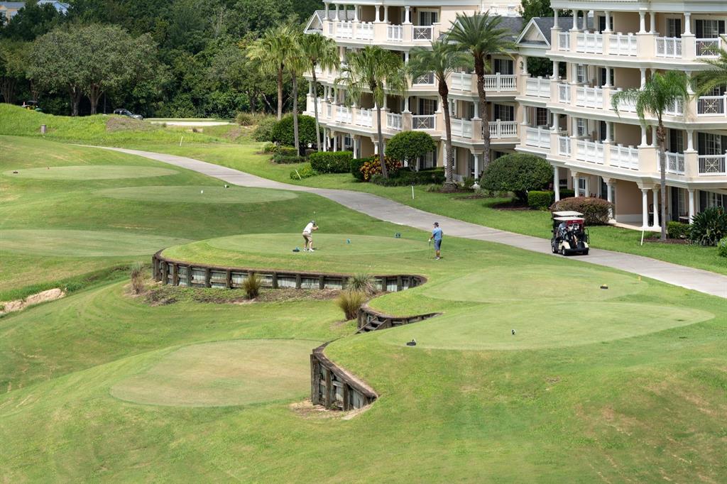 1370 Centre Ct Ridge Drive, Unit 401 Reunion, FL 34747 - Photo 39 of 51 a view of a building with yard in front of it