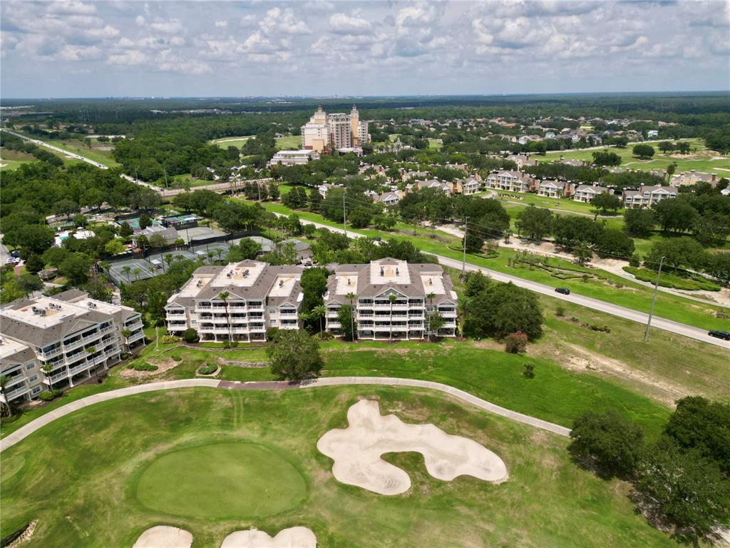 1370 Centre Ct Ridge Drive, Unit 401 Reunion, FL 34747 - Photo 40 of 51 a view of a swimming pool in a field
