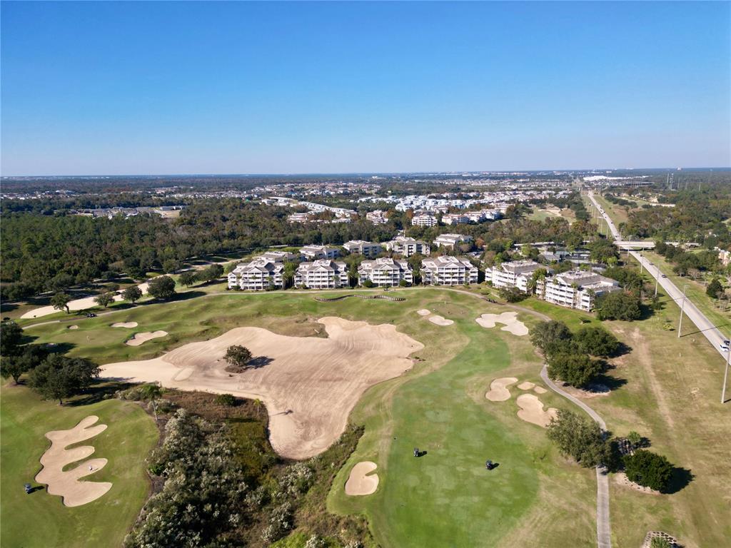 1370 Centre Ct Ridge Drive, Unit 401 Reunion, FL 34747 - Photo 45 of 51 an aerial view of residential houses with outdoor space