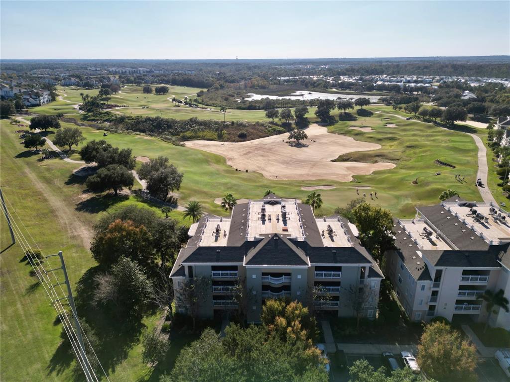1370 Centre Ct Ridge Drive, Unit 401 Reunion, FL 34747 - Photo 47 of 51 an aerial view of residential houses with outdoor space