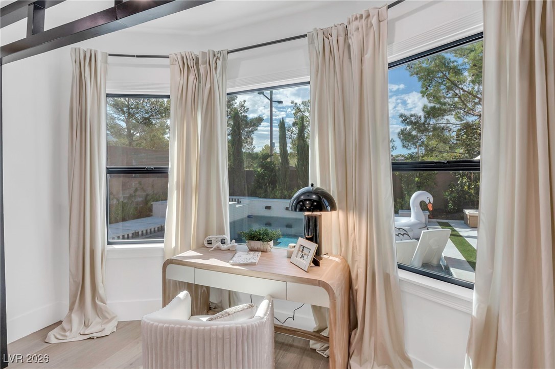 2709 Rue Toulouse Avenue Henderson, NV 89044 - Photo 16 of 43 Primary Bedroom Bay Window Workspace Overlooking Pool and Backyard